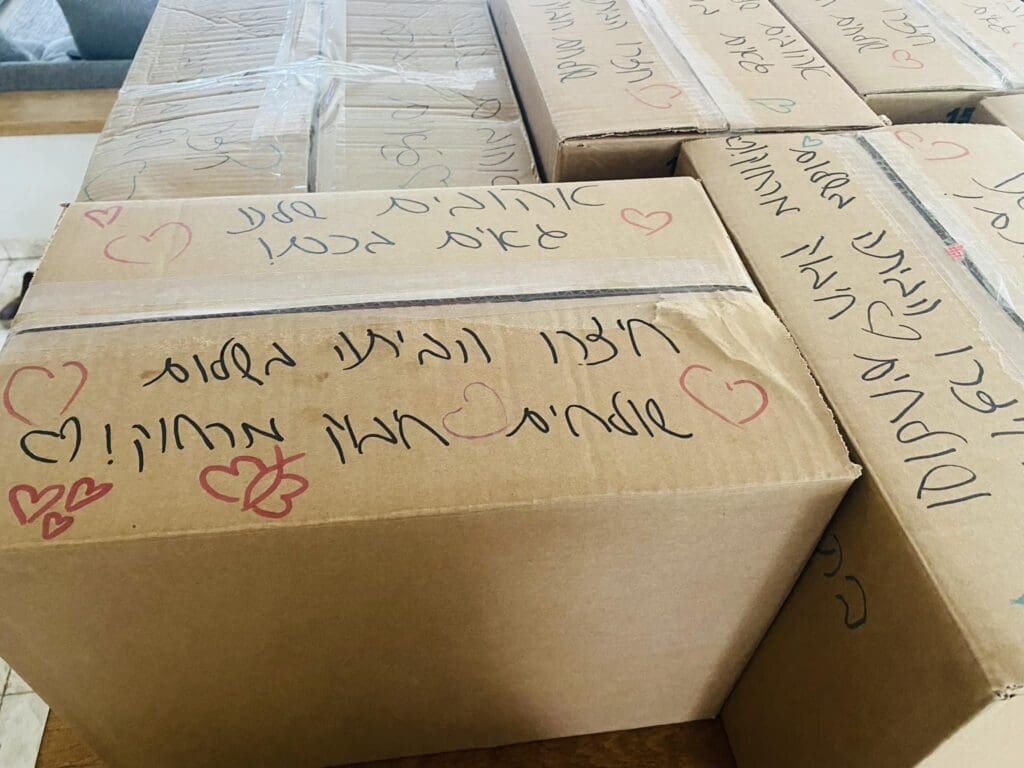 Boxes of aid with heartfelt messages for the victims of the October 7th attacks in Israel.