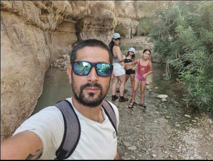 Sa'ar Margolis with his family on a hike before heroically defending his kibbutz.