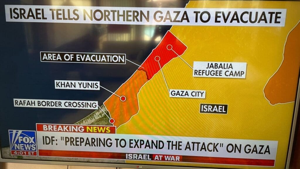 A televised news graphic showing an evacuation alert for Northern Gaza.